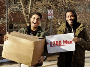 Julian Santiago (left) and Anthony Townsend, both alumni of Alvarez High School, are thrilled to receive a care package through the 300 Men organization.