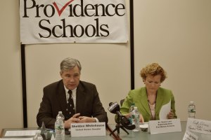U.S. Senator Sheldon Whitehouse, seated with Supt. Dr. Susan Lusi, leads a discussion about changes to federal elementary and secondary education programs.