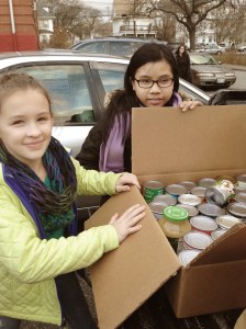 Webster Avenue fifth graders load donated canned goods to be transported to the Rhode Island Food Bank.